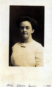 Close-up of a dark-haired woman wearing eyeglasses