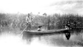 Ingraham Billie moves canoe down Turner River
