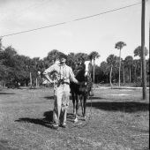 Irvin Peithmann standing next to a horse