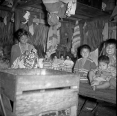 Seminole woman making dolls