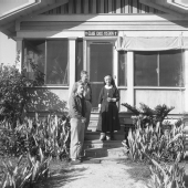 Deaconess Harriet Bedell, Dr. Georg Neumann, and Holm Neumann standing in front of the Glade Cross Mission