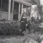 Deaconess Harriet Bedell standing in front of the Glade Cross Mission