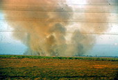 Smoke rising from fires on the horizon