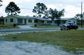 Car parked in front of a home at the Big Cypress Seminole Indian Reservation