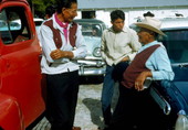 Seminole Indian men by their cars at the Dania Seminole Indian Reservation