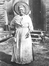 Selina Rollins standing outside a house : Micanopy, Florida