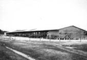 Open-air building and trucks