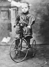 Boy on tricycle.