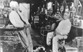 Ted Smallwood and Ernest F. Coe visit at the store