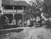 Jules T. Rembert sitting on the porch of his house in Cocoa.