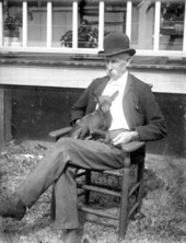 Man with dog in his lap