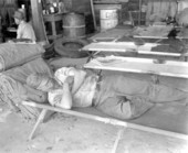 Firefighter resting on a cot.