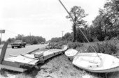 Boats and section of dock washed ashore by Hurricane Elena