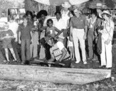 O.B. Osceola carving a canoe