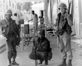 Guardsmen outside a looted store.