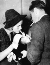 Mr. and Mrs. Nicholas Ridgely du Pont smoking