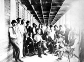 Men on the porch of Julia Tuttle's Hotel.