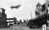 The Goodyear blimp Vigilant over street