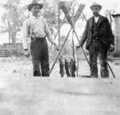 Men with their catch of fishes.
