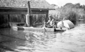 Mr. Elgin Wefing in his homemade steam boat
