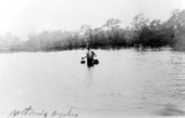 Man gathering oysters at Fort Myers Beach.