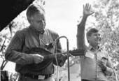 Wayne Mixson plays mandolin while gubernatorial candidate Bob Graham waves to crowd.