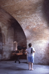 Woman looking at a wall inside Fort Clinch - Fernandina Beach, Florida