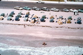 Colorful cabanas and swimmers on Miami Beach- Miami Beach, Florida