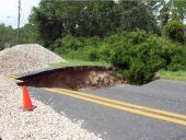Sink hole in Alligator Road after Hurricane Dennis - Alligator Point, Florida.