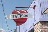 Close-up view of Euphoria Tattoo shop sign located at 522 West Gaines Street - Tallahassee, Florida.