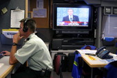 National guardsman Major Tad Warfel inside the State of Florida's Mobile Command Unit maintained by the Division of Emergency Management