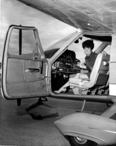 Unidentified woman in the cockpit of a private Cessna airplane - Fort Lauderdale, Florida.