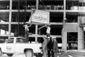 Sign being hoisted during construction of the American Express Southern Regional Operations Center - Plantation, Florida