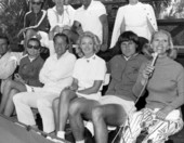 Dinah Shore (right) sitting with tennis player Ilie Nastase and friends at an unidentified event - Fort Lauderdale, Florida