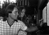 Unidentified mixed doubles tennis players looking over chart - Fort Lauderdale, Florida