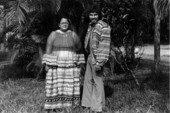 Former Chair of the Seminole Tribe of Florida Betty Mae Jumper and future chairman James 'Jim' Billie posing together for a portrait - Fort Lauderdale, Florida.