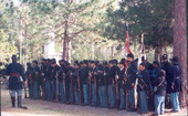 View showing some of the participants assembled for re-enactment of battle during festival at Olustee Battlefield Historic State Park - Baker County, Florida