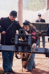 Men with cannon at battle reenactment during festival at the Olustee Battlefield Historic State Park - Baker County, Florida.