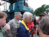 Florida Governor Charlie Crist and the Adjutant General of the Florida National Guard Maj. Gen. Douglas Burnett speak with the press near a flooded area of Melbourne, Fla.