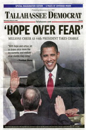 Front page of the Tallahassee Democrat newspaper reporting the 44th President of the United States of America Barack Obama taking the oath of office from Chief Justice John Roberts.
