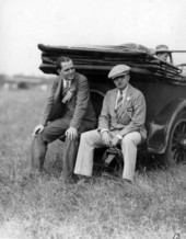 Men sitting at the grand opening of Dale Mabry Field in Tallahassee, Florida.