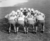 Jax-Navy football team "Navy Fliers" in a huddle - Jacksonville, Florida.