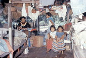 Seminole Indian family in their chickee hut in the Everglades of Florida.