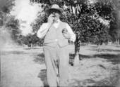 Mr. McMaster in Lester Crosly Newell's grove.