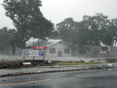 View showing flood waters from Hurricane Dennis around building in Apalachicola, Florida.
