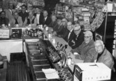 Group portrait of Lion Club members in a Lake Wales drug store.