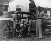 Florida Highway Patrol Lt. J.W. Hagan and Capt. Martin administering first aid - Panama City, Florida.