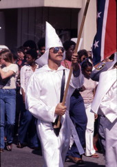 Close-up view showing a KKK member marching in a rally on South Monroe Street in Tallahassee, Florida.