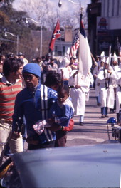 View showing KKK members on South Monroe Street during a rally in Tallahassee, Florida.