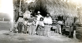 Portrait of Hazel and Doc Engelbert with Seminoles at a Seminole Indian Village in Florida.